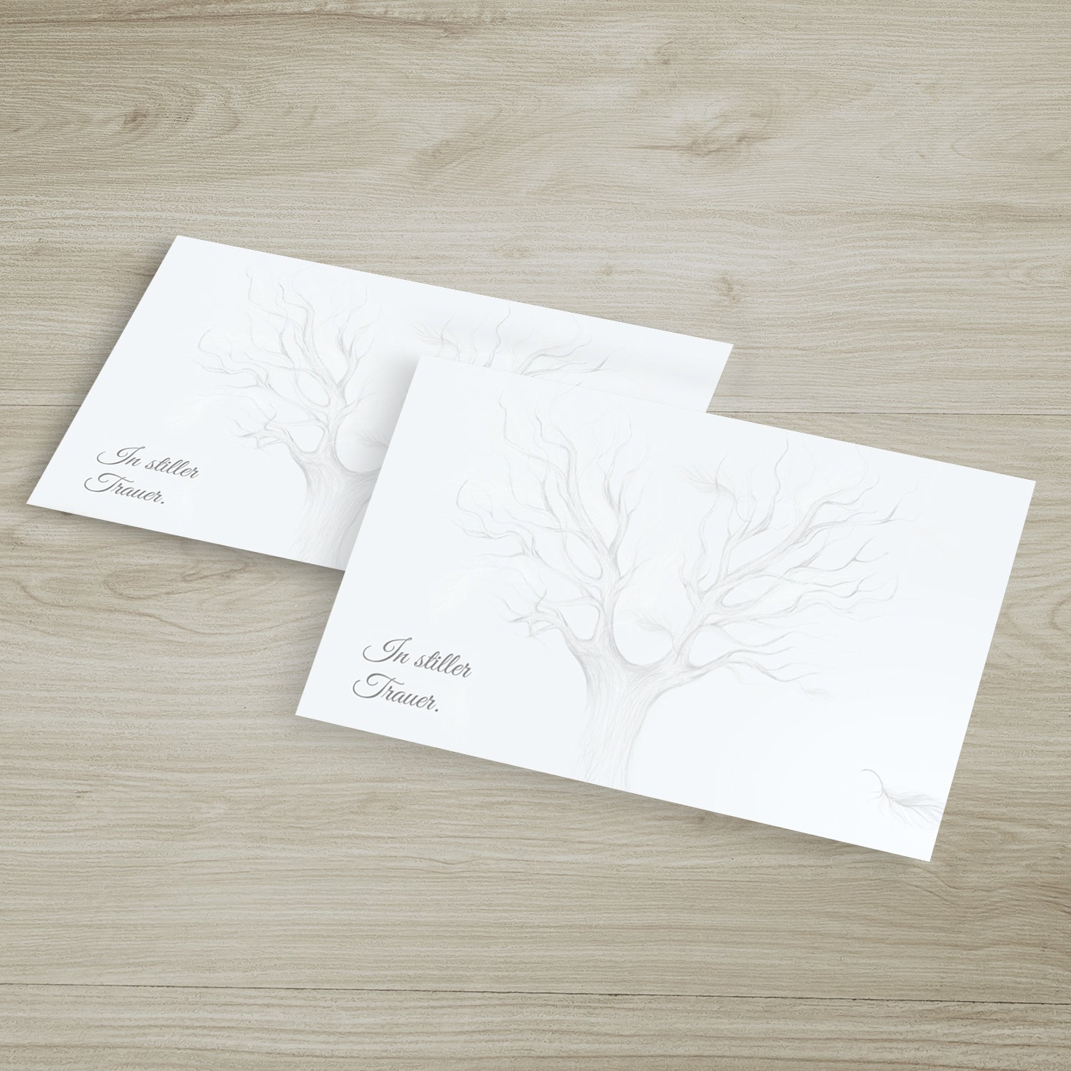 Zehn hochwertige, nachhaltige Trauerkarten mit filigranem Baum-Design und dezentem Schriftzug.