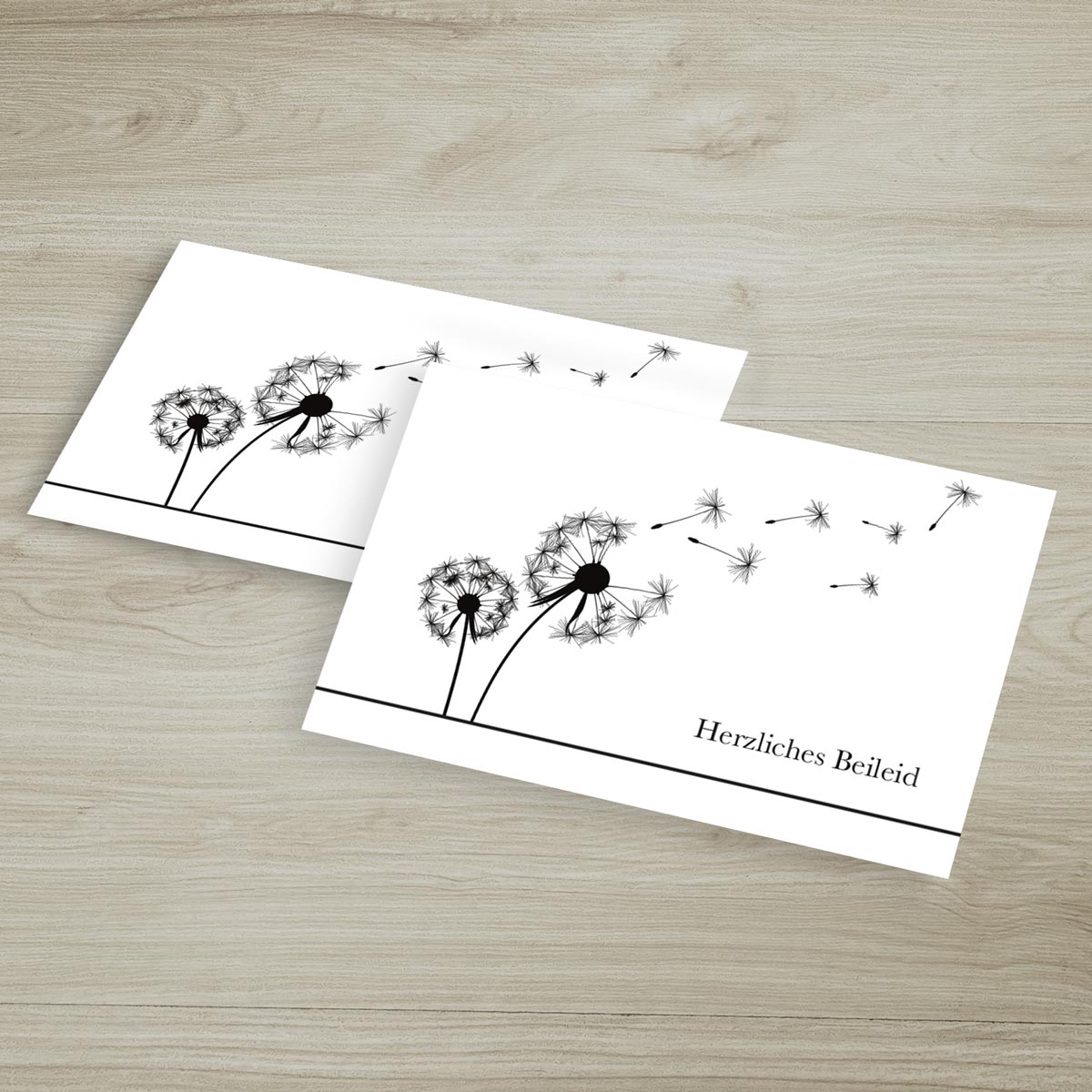 Zehn hochwertige nachhaltige Trauerkarten mit zartem Pusteblumen-Design und Umschlag.